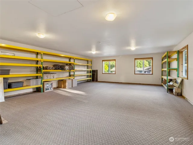 a view of a livingroom with furniture and a window
