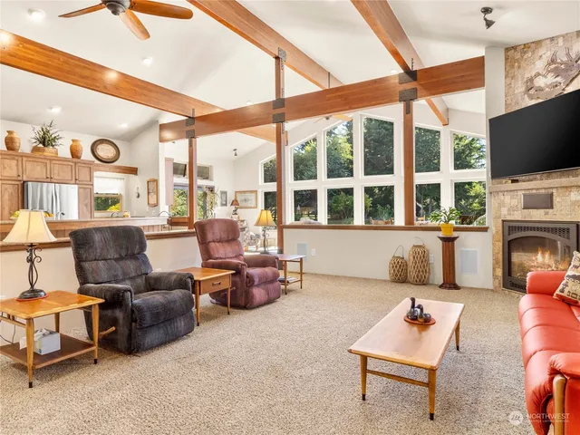 a living room with fireplace furniture and a flat screen tv