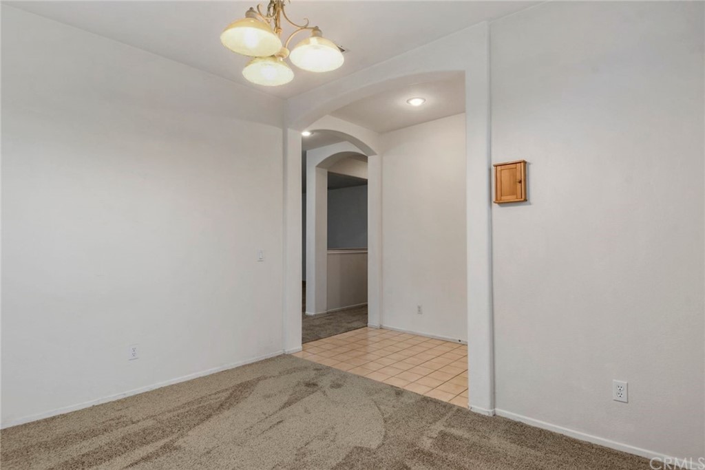 32175 Beaulieu Road Winchester, CA 92596 - Photo 19 of 31 a view of a room with wooden floor and a ceiling fan