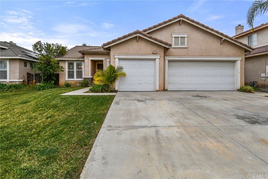 32175 Beaulieu Road Winchester, CA 92596 - Photo 2 of 31 a front view of a house with a yard and garage