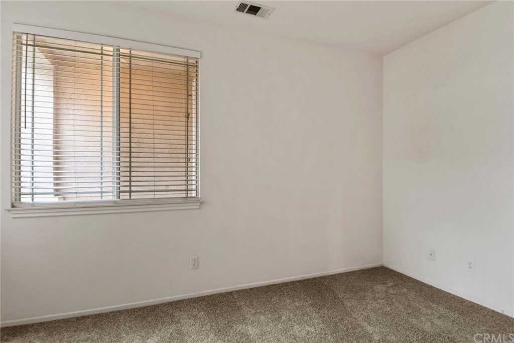 32175 Beaulieu Road Winchester, CA 92596 - Photo 23 of 31 an empty room with a window