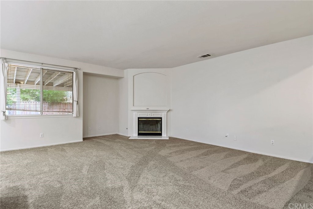 32175 Beaulieu Road Winchester, CA 92596 - Photo 7 of 31 an empty room with windows