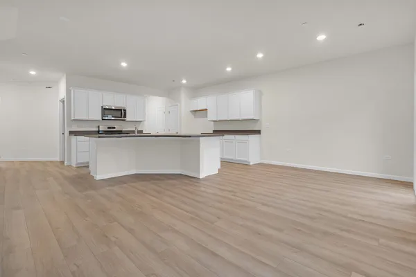 a kitchen with stainless steel appliances granite countertop a sink and cabinets