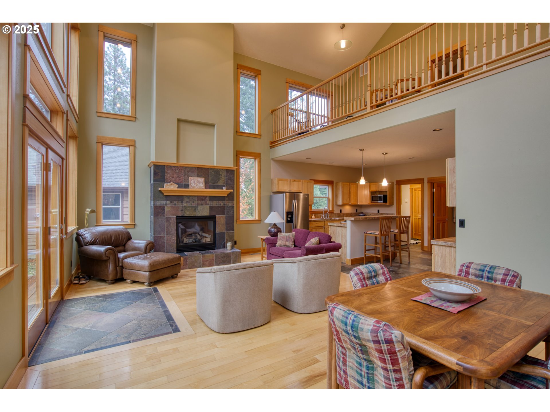 10 Emma Lane Trout Lake, WA 98650 - Photo 11 of 45 a living room with furniture a fireplace and a projector