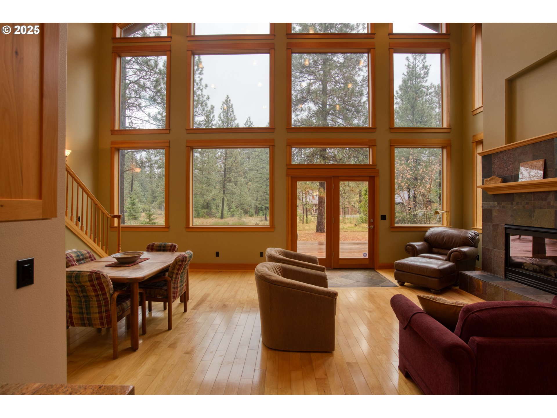 10 Emma Lane Trout Lake, WA 98650 - Photo 14 of 45 a living room with furniture a fireplace and windows