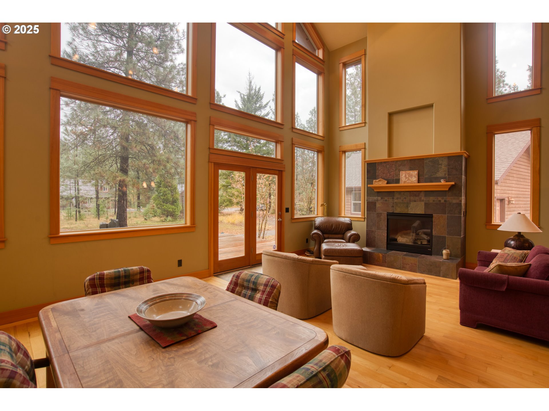 10 Emma Lane Trout Lake, WA 98650 - Photo 15 of 45 a living room with furniture a fireplace and a large window