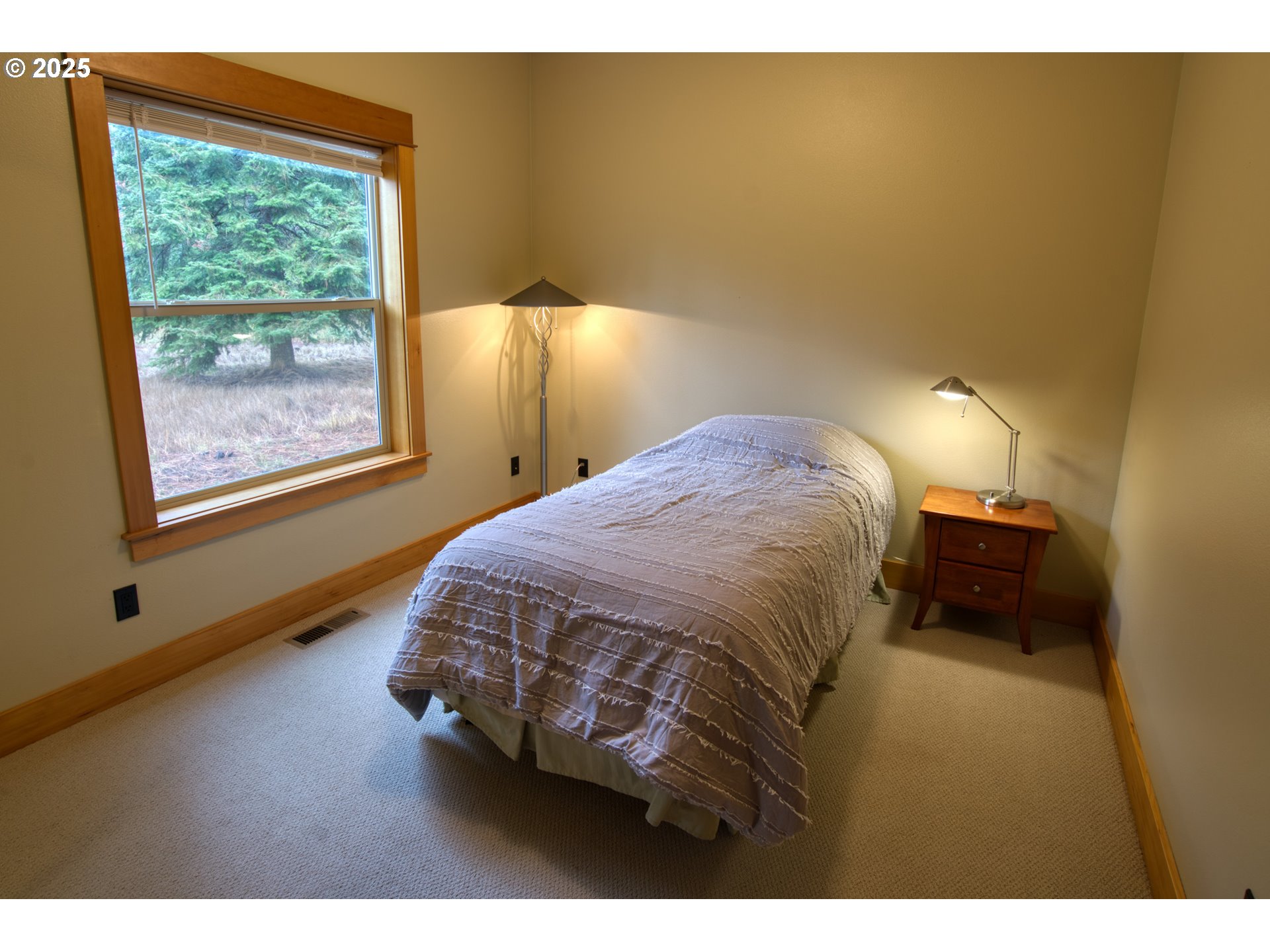 10 Emma Lane Trout Lake, WA 98650 - Photo 22 of 45 a bedroom with a bed and a window