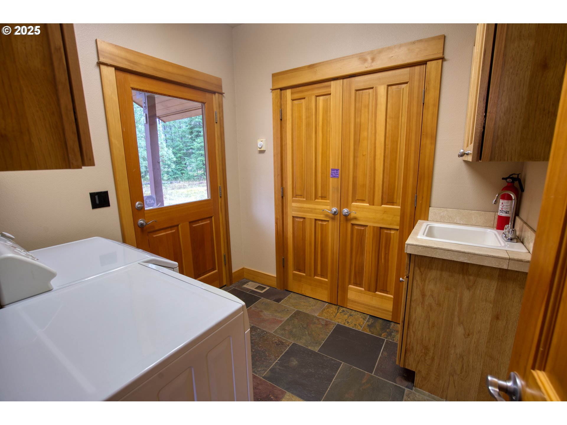 10 Emma Lane Trout Lake, WA 98650 - Photo 43 of 45 a bedroom with a bed and a mirror