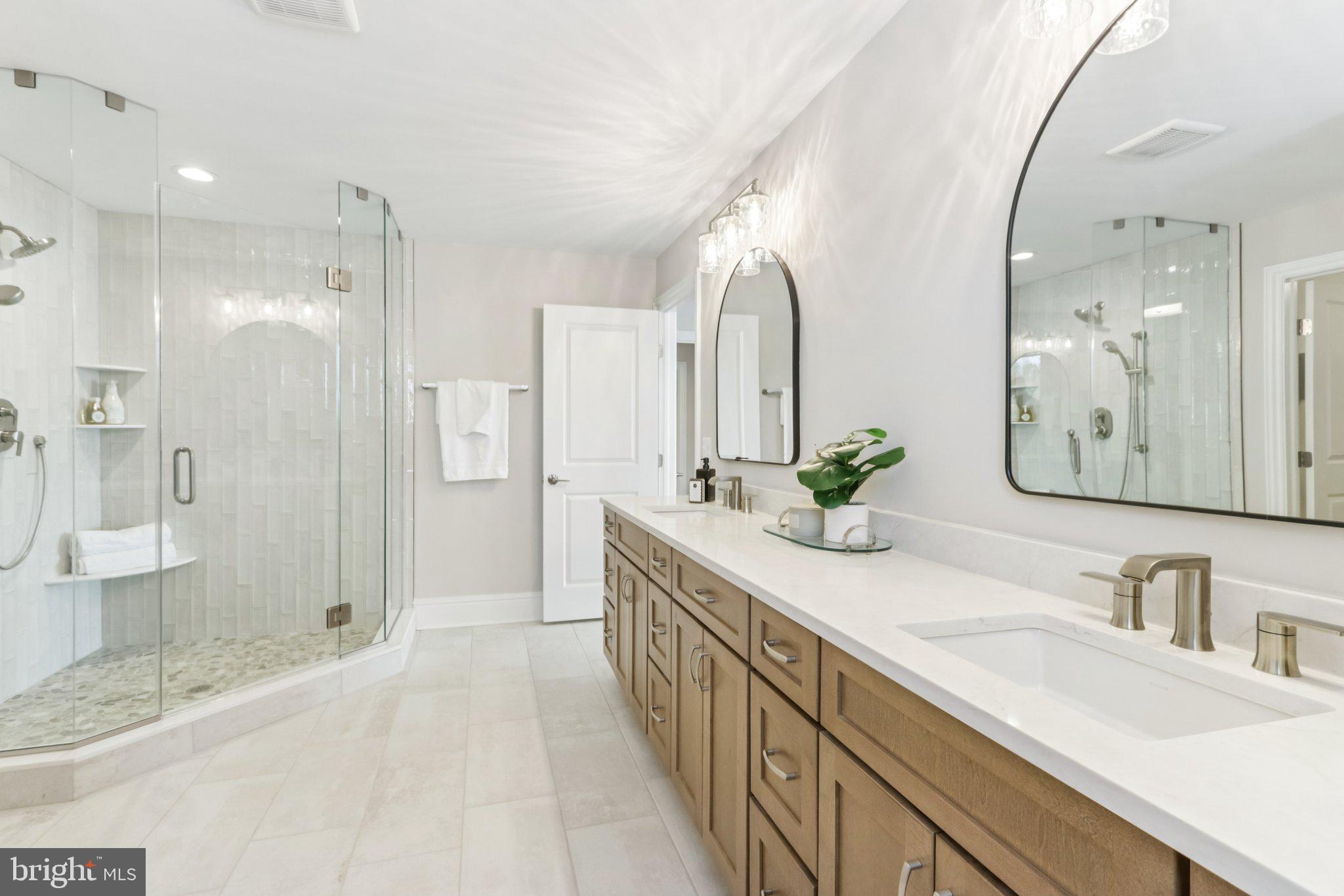 510 Newcomen Road, Unit B3D Exton, PA 19341 - Photo 56 of 74 a bathroom with a granite countertop double vanity sink and mirror