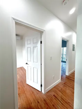 a view of entryway with wooden floor