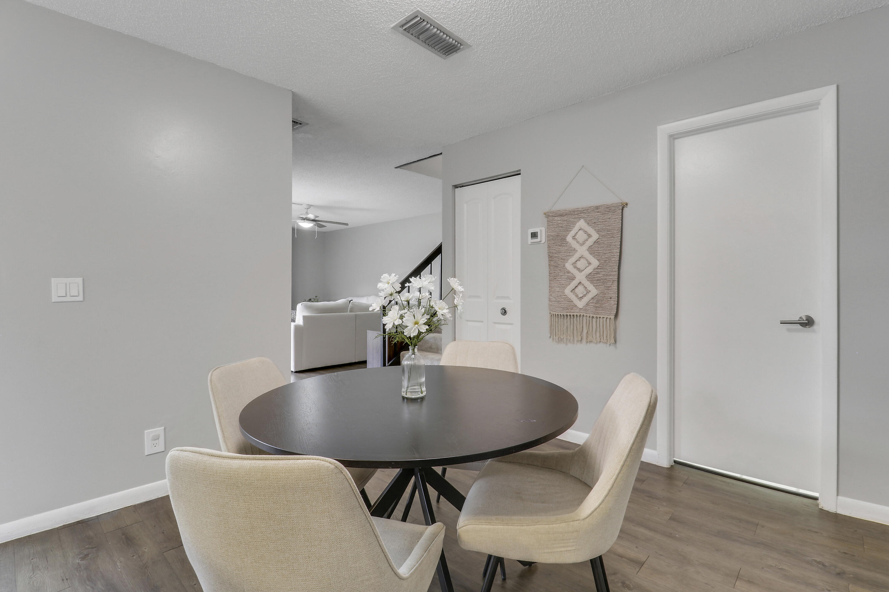 187 Woodland Road Palm Springs, FL 33461 - Photo 12 of 29 a dining room with furniture and wooden floor