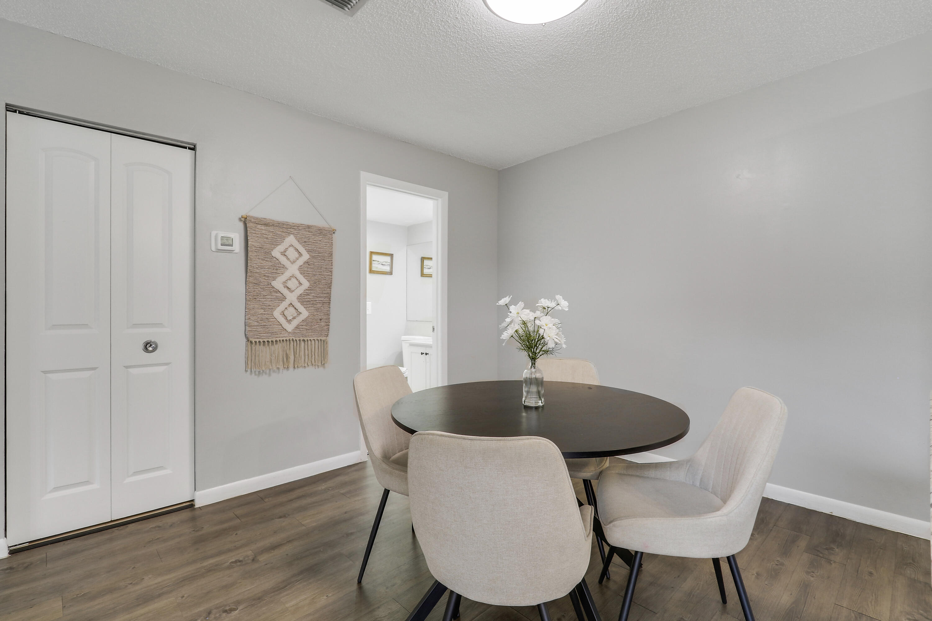 187 Woodland Road Palm Springs, FL 33461 - Photo 14 of 29 a table and chairs in a room