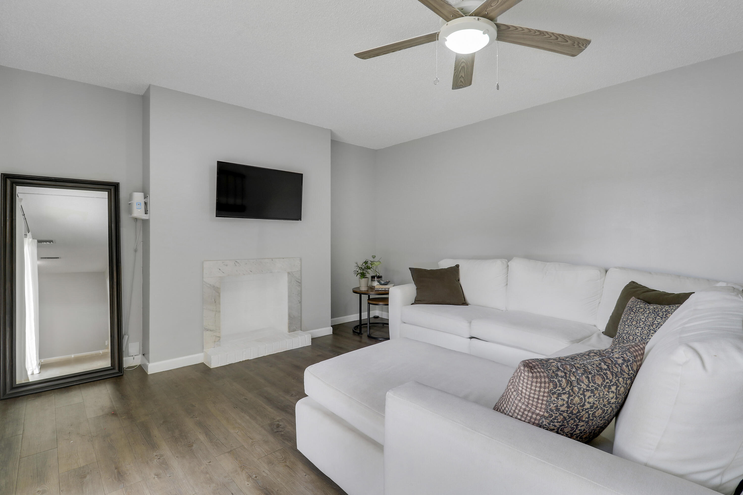 187 Woodland Road Palm Springs, FL 33461 - Photo 18 of 29 a living room with furniture and a flat screen tv