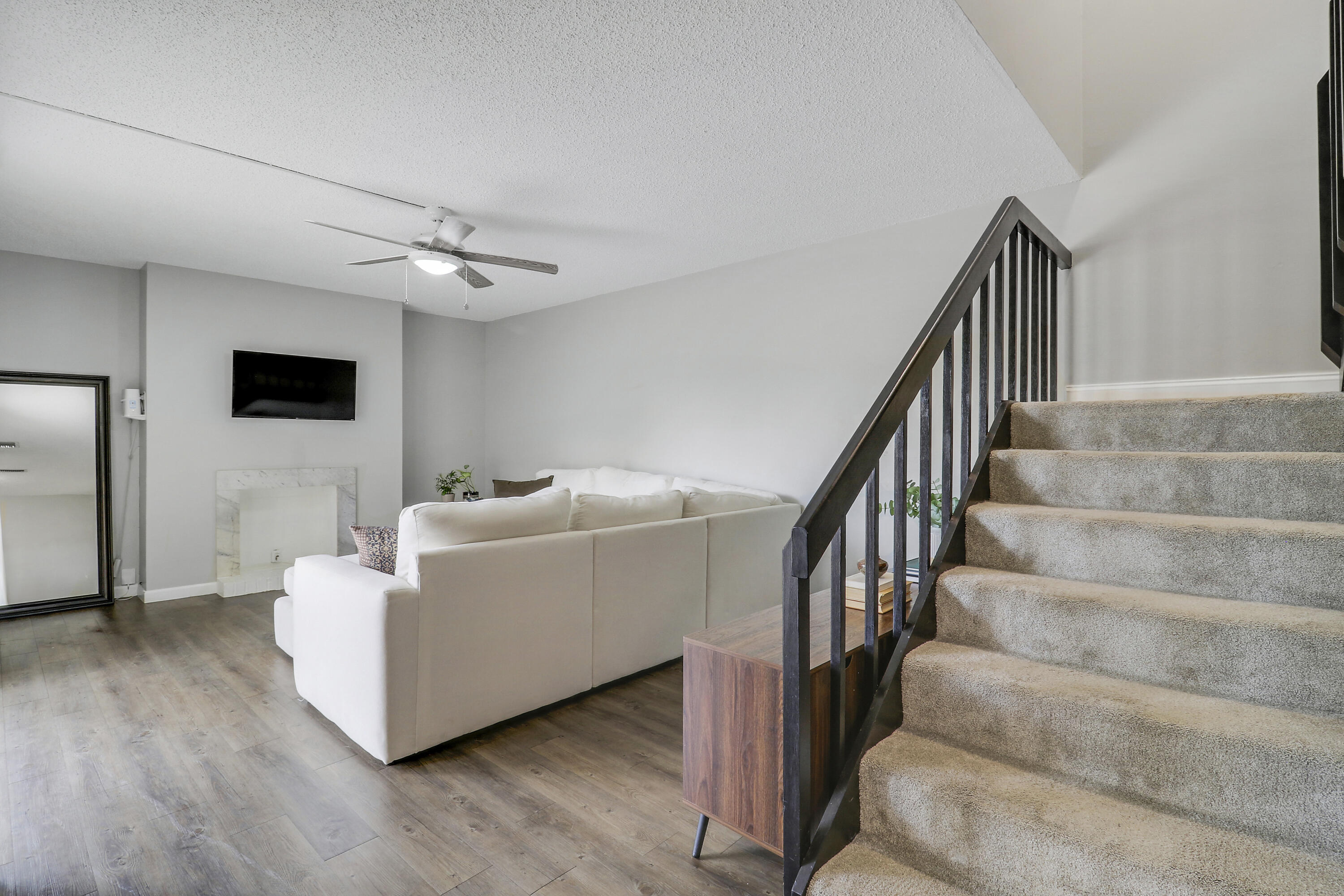187 Woodland Road Palm Springs, FL 33461 - Photo 20 of 29 a living room with couches and a flat screen tv
