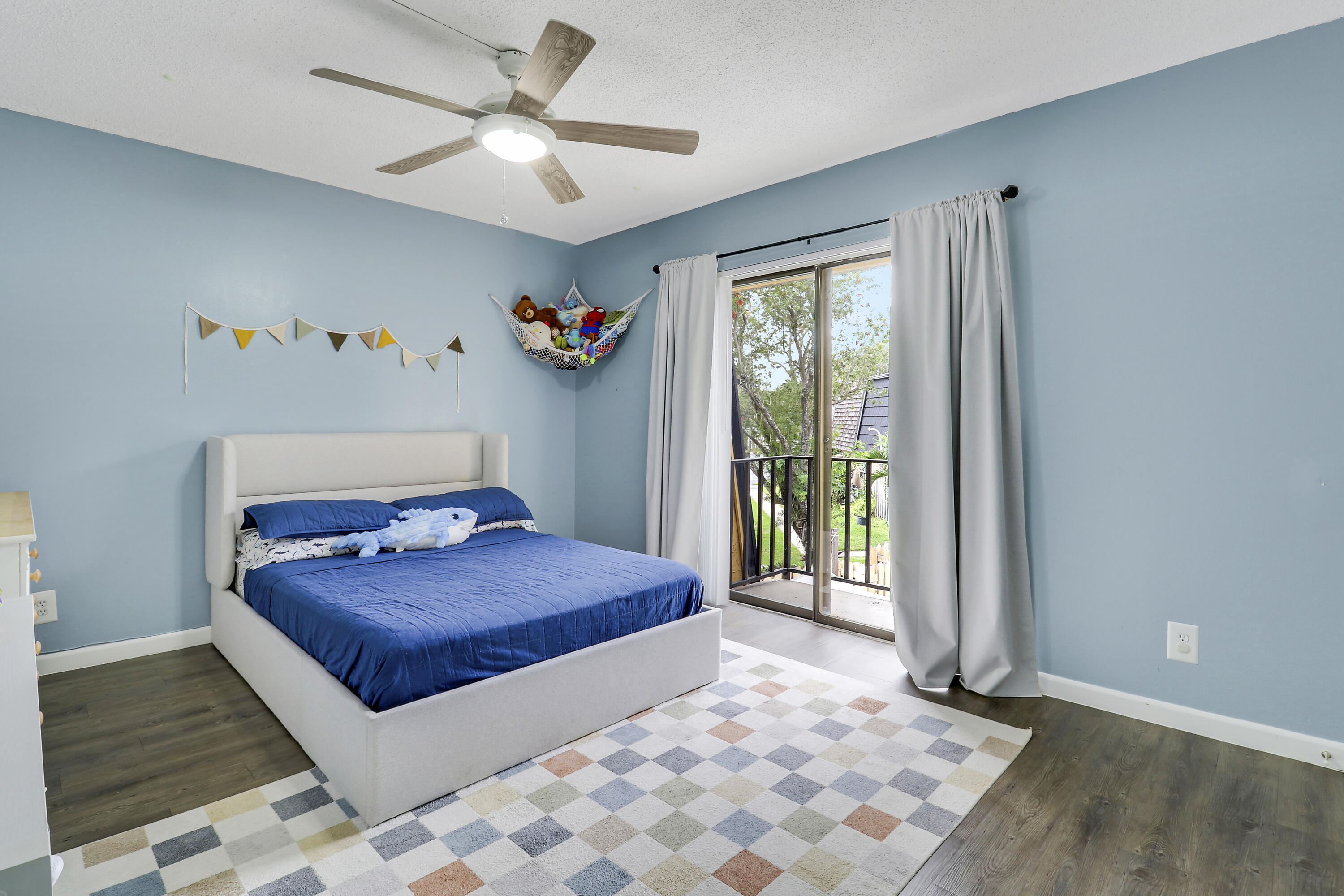 187 Woodland Road Palm Springs, FL 33461 - Photo 24 of 29 a bedroom with a bed and a window
