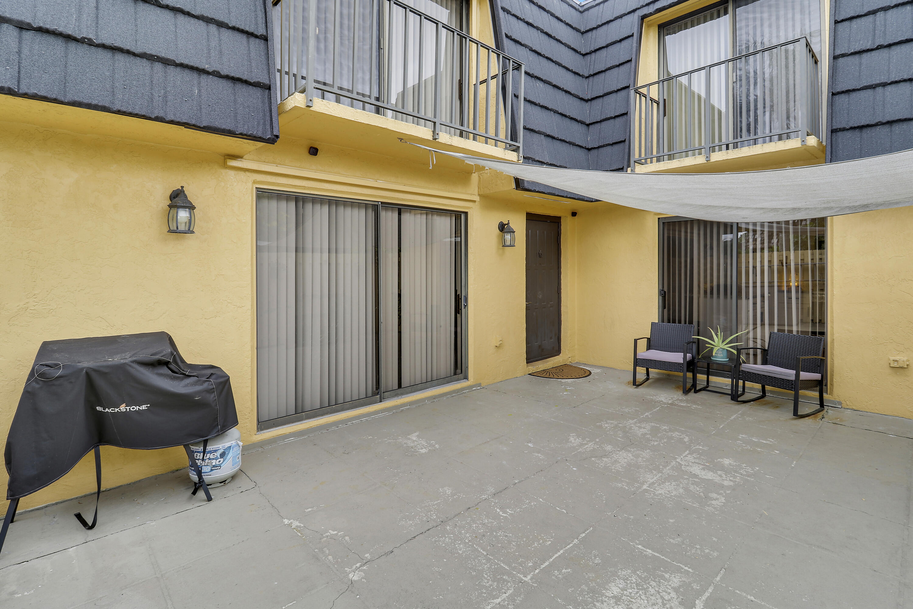 187 Woodland Road Palm Springs, FL 33461 - Photo 5 of 29 a view of a patio with table and chairs