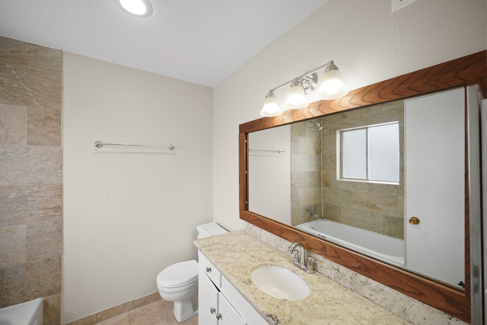 2201 Fountain View Drive, Unit 60F Houston, TX 77057 - Photo 16 of 18 a bathroom with a sink and a mirror