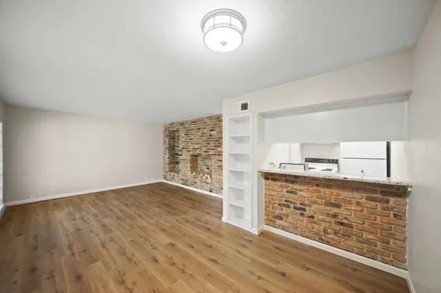 a view of kitchen with wooden floor