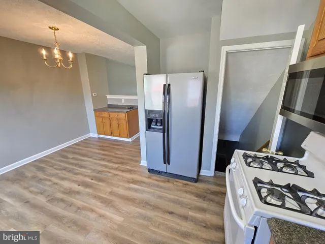 a view of room with wooden floor and window