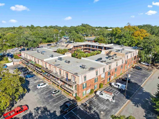 an aerial view of a house with a big yard