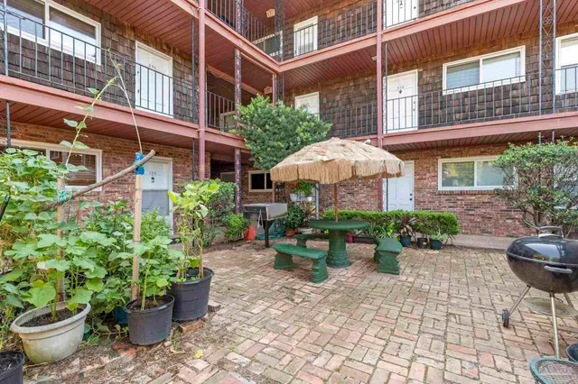 a view of a swimming pool with a sitting space