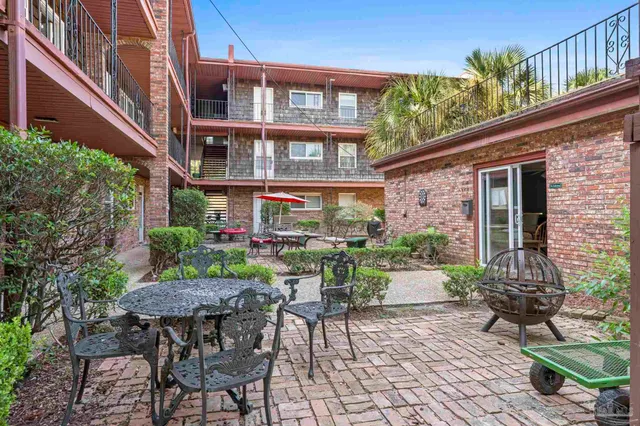 a view of a brick house with a door