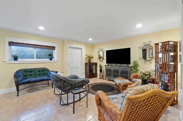 a living room with furniture and a rug