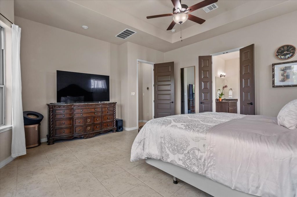 6705 Destination Way Jonestown, TX 78645 - Photo 16 of 39 Tall double doors lead into the stunning en-suite bathroom.