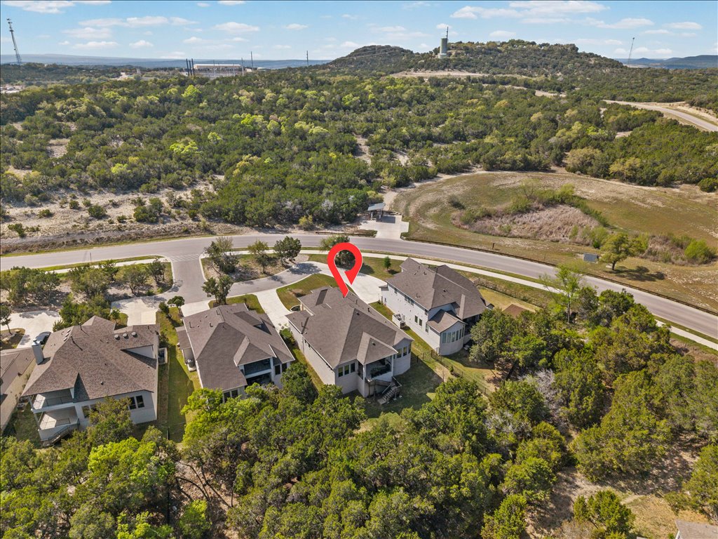 6705 Destination Way Jonestown, TX 78645 - Photo 32 of 39 The ultimate backyard. Looking back toward the house, you can see how the property backs directly into the dense, protected brush of the Hill Country.