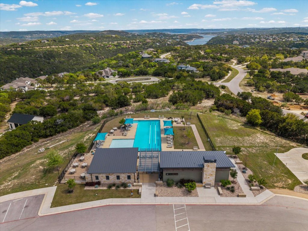 6705 Destination Way Jonestown, TX 78645 - Photo 34 of 39 The neighborhood hub. This pristine lap pool and clubhouse area offer a sleek, modern space to cool off during those famous Texas summers. With shaded cabanas and plenty of lounging room, it’s like having a private club just minutes from your doorstep.