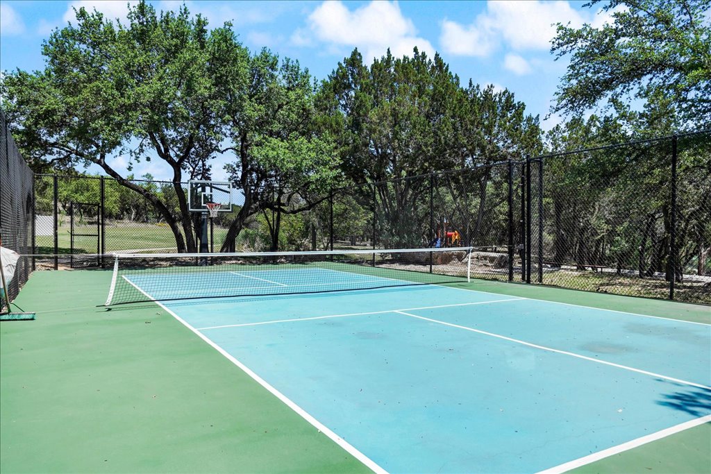 6705 Destination Way Jonestown, TX 78645 - Photo 37 of 39 Work on your serve or your jump shot. The community’s multi-sport courts are tucked away in a quiet, wooded corner, offering a picturesque spot for a friendly match of tennis or basketball.