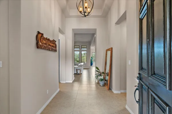 a view of a hallway with seating area