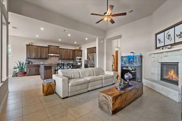 a living room with furniture and a fireplace