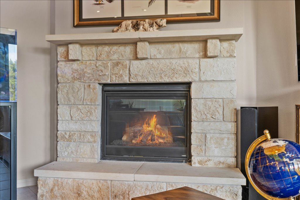 6705 Destination Way Jonestown, TX 78645 - Photo 8 of 39 The limestone hearth adds a touch of Texas Hill Country soul to the modern interior, topped with a thick mantel perfect for displaying your favorite treasures.