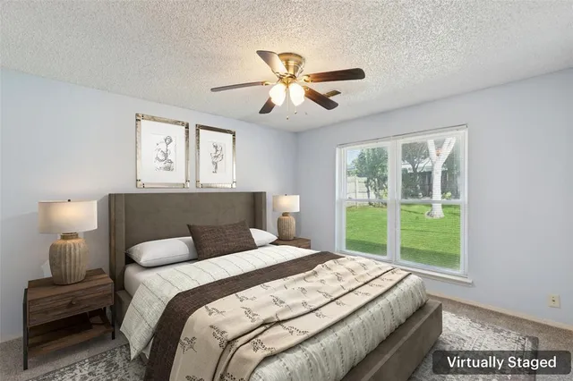 a bedroom with a large bed and a window