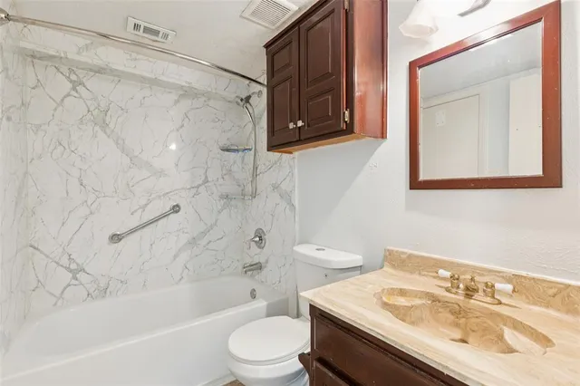 a bathroom with a sink a toilet and a bathtub