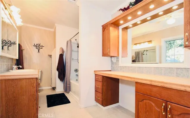 a kitchen with a sink a refrigerator a stove and a window