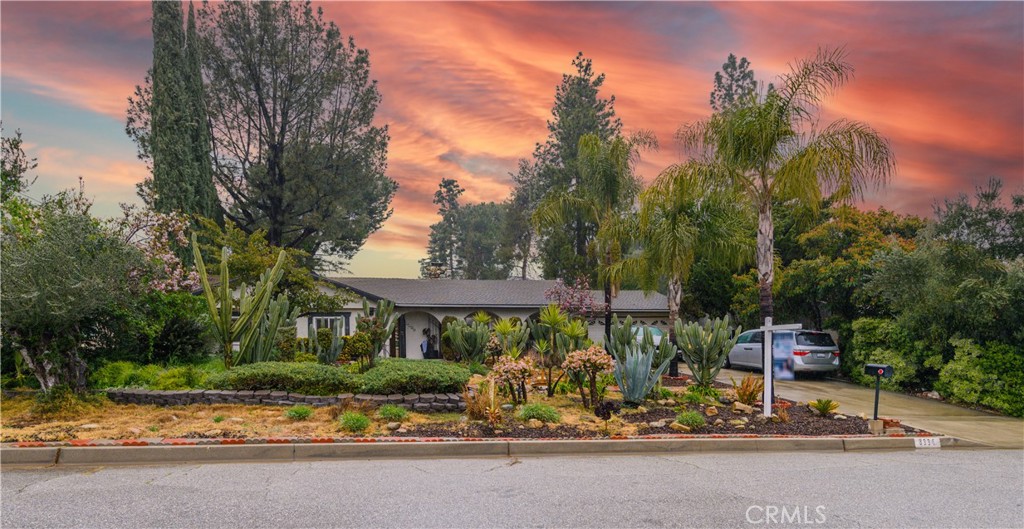 8336 La Senda Road Rancho Cucamonga, CA 91701 - Photo 1 of 1 a view of patio with a table and chairs under an umbrella