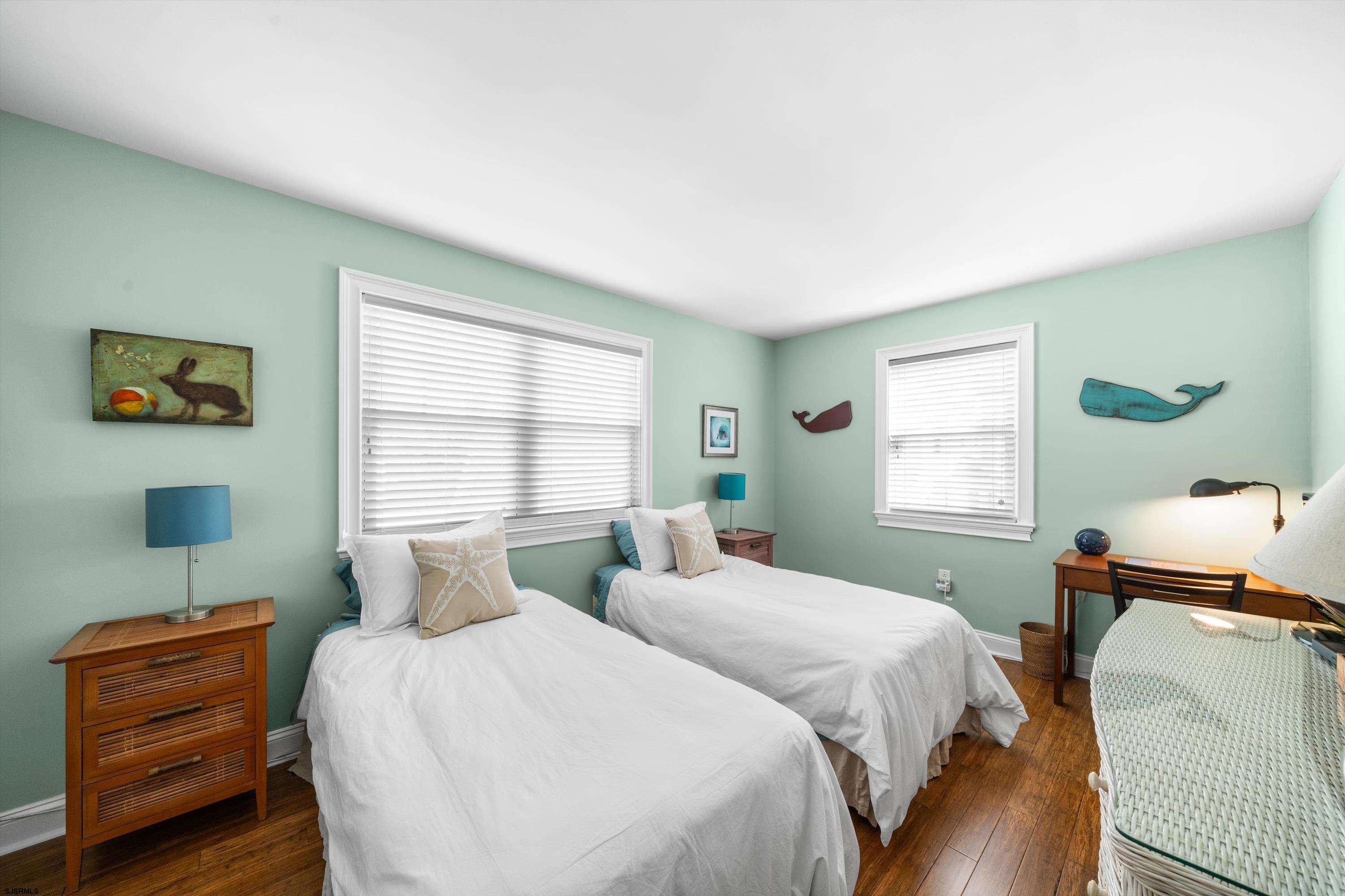 51 Simpson Road, Unit 2 Ocean City, NJ 08226 - Photo 30 of 43 a bedroom with a bed and window