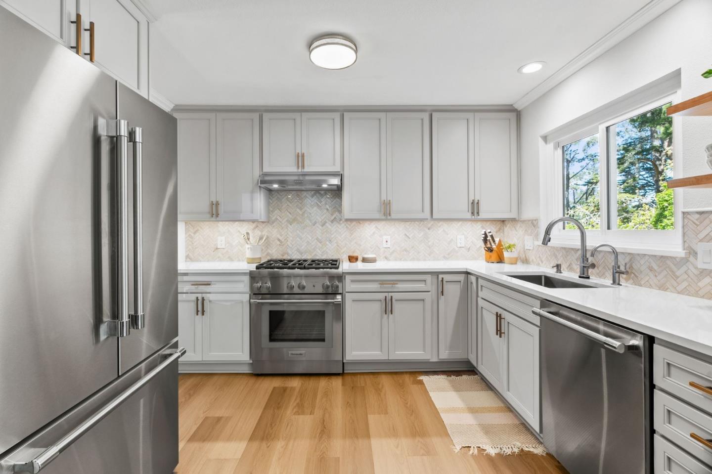 1085 Barcelona Drive Pacifica, CA 94044 - Photo 11 of 55 a kitchen with a sink stove and refrigerator