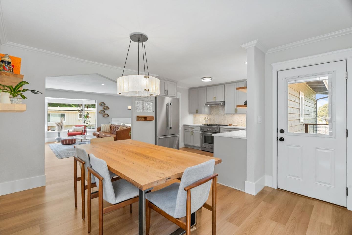 1085 Barcelona Drive Pacifica, CA 94044 - Photo 13 of 55 a view of a dining room and livingroom with furniture wooden floor a chandelier