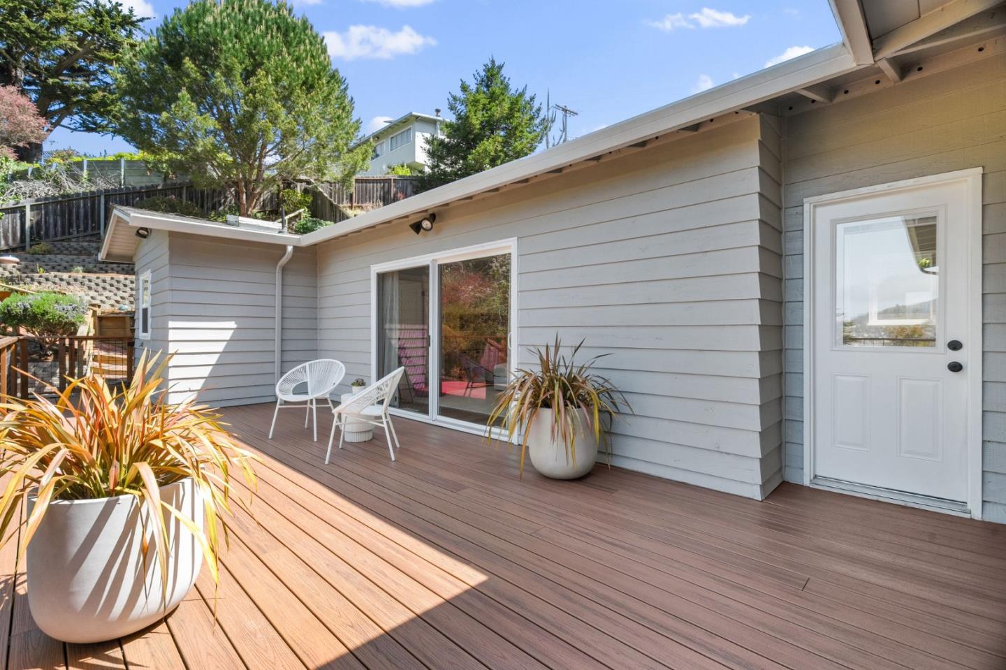 1085 Barcelona Drive Pacifica, CA 94044 - Photo 18 of 55 a view of a patio with table and chairs and potted plants