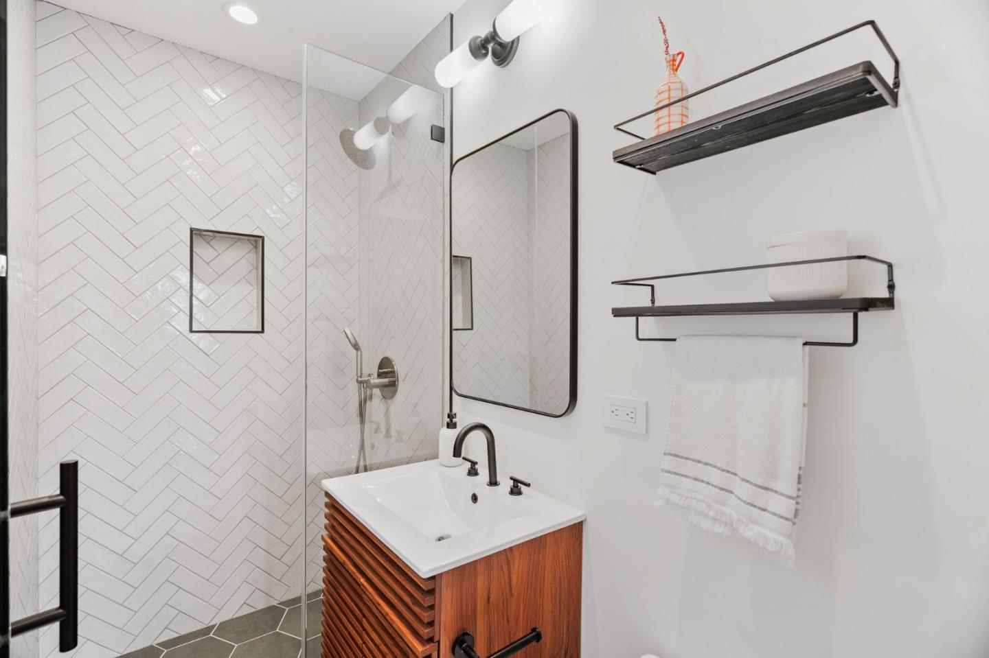 1085 Barcelona Drive Pacifica, CA 94044 - Photo 30 of 55 a bathroom with a sink mirror and shower