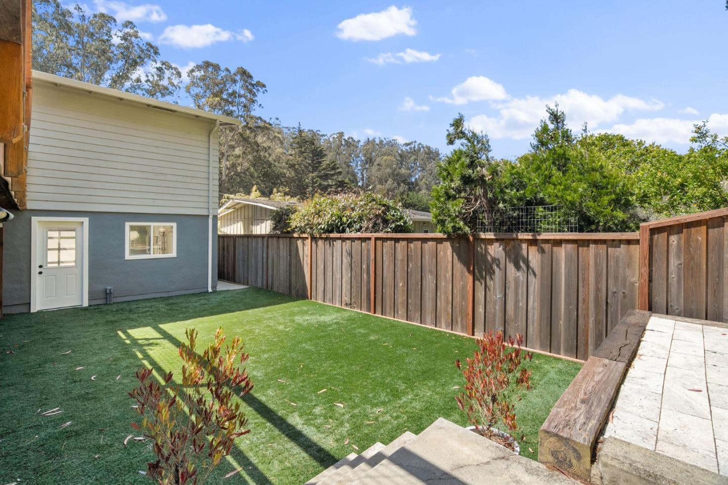 1085 Barcelona Drive Pacifica, CA 94044 - Photo 32 of 55 a view of a backyard with a garden