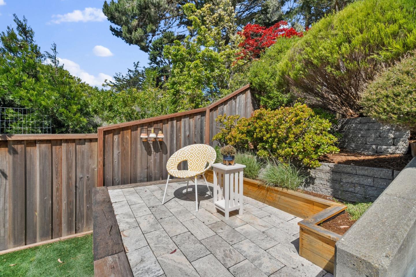 1085 Barcelona Drive Pacifica, CA 94044 - Photo 33 of 55 a view of a chairs and table in the back yard of the house