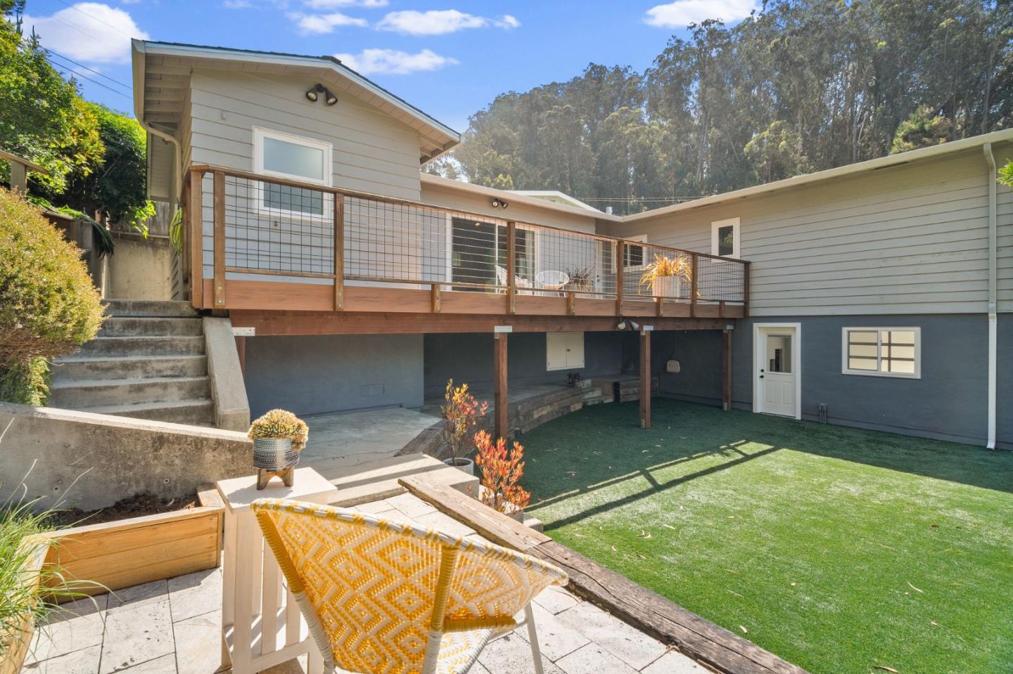 1085 Barcelona Drive Pacifica, CA 94044 - Photo 34 of 55 a view of a house with a backyard and a patio