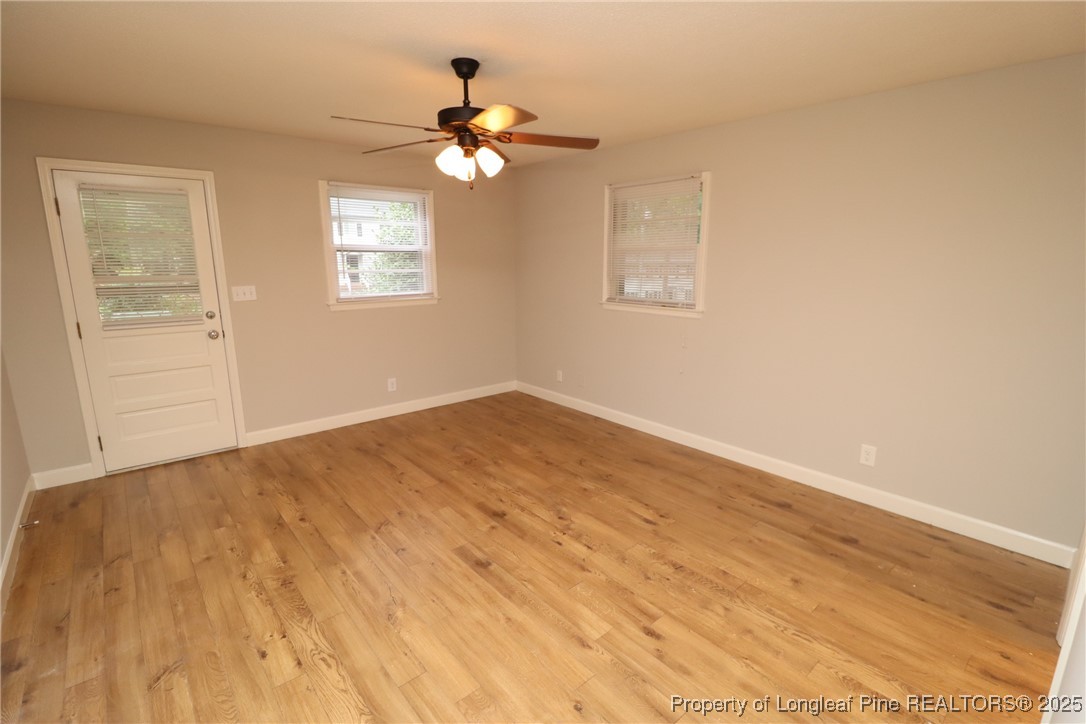 1426 Trinity Circle Raleigh, NC 27607 - Photo 19 of 31 a view of empty room with wooden floor