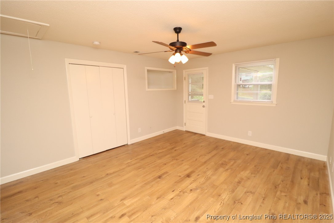 1426 Trinity Circle Raleigh, NC 27607 - Photo 20 of 31 a view of empty room with wooden floor and fan