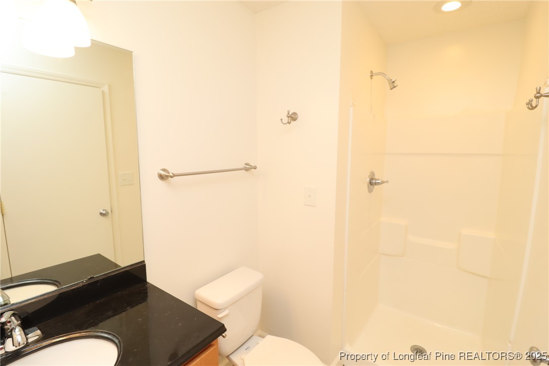 1426 Trinity Circle Raleigh, NC 27607 - Photo 24 of 31 a bathroom with a sink and a toilet