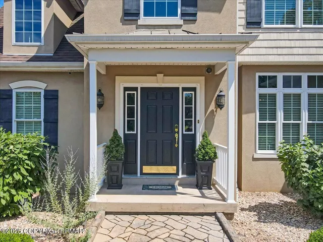 a kitchen with stainless steel appliances granite countertop a refrigerator a oven a sink and a stove